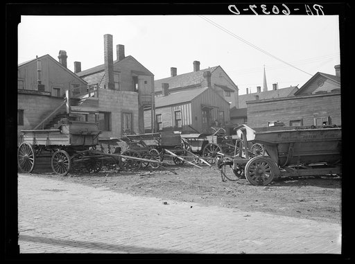 Rear of houses on 7th Street between Juneau and McKinley Streets. Milwaukee, Wisconsin