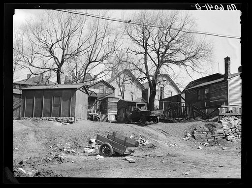 Closeup of rear of houses in 900 block on West Clyburn Street. Milwaukee, Wisconsin