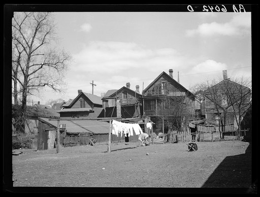 Rear of group of houses in 900 block on West Clybourn Street. Milwaukee, Wisconsin