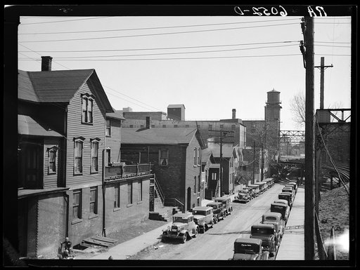 Residential houses crowded in industrial district. Milwaukee, Wisconsin
