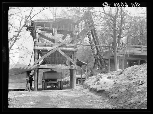 Rock crusher crushing rock to be placed on trails on Pere Marquette recreational project. Grafton, Illinois
