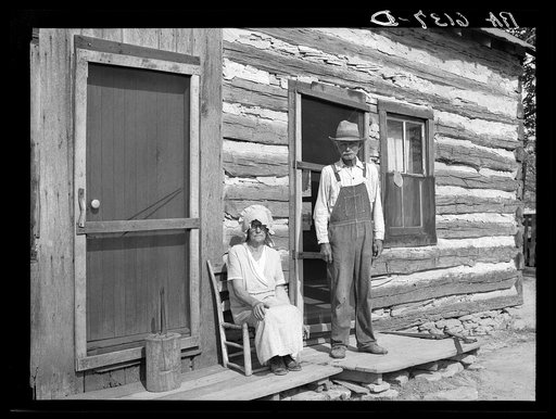 Nick Phillips, eighty-one years old with wife in front of house. Ashland, Missouri. Missouri game and arboretum project. Columbia, Missouri