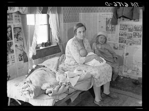Interior of Ozarks cabin housing six people. Missouri