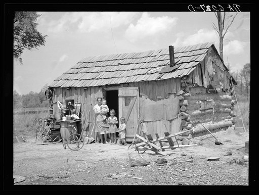 Portion of family of seven in their cabin on United States Highway No. 60 in southeastern Missouri