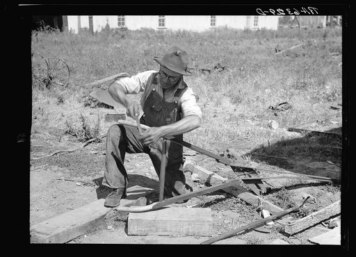 Repairing a plow on farm. Near West Memphis. Tennessee