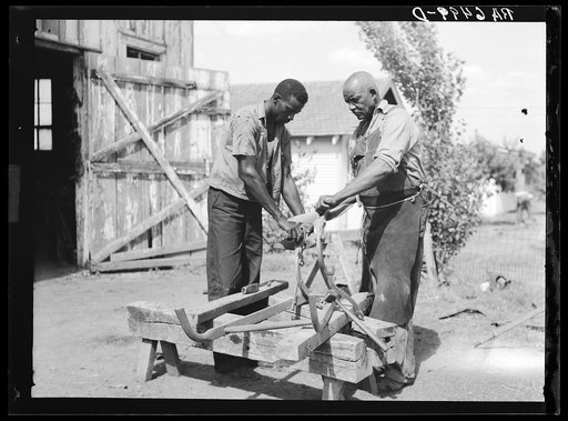 "Double shovel" cultivator being repaired at Sunflower plantation. Near Sunflower, Mississippi