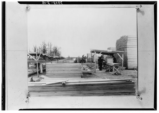 Lumber being pre-cut preparatory to nailing in sections. Prefabricated construction at La Forge project, Missouri
