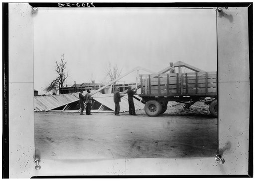 Prefabricated sections being loaded on a truck. La Forge, Missouri