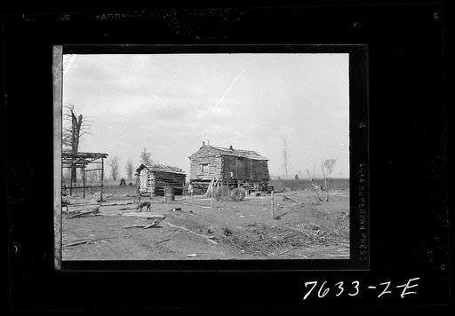 Homemade log shack vacated by first Negro family to move into group labor homes. Southeast Missouri