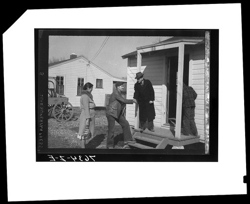 Carl O. Hudson, camp manager, welcomes Wicker family to new home. Southeast Missouri