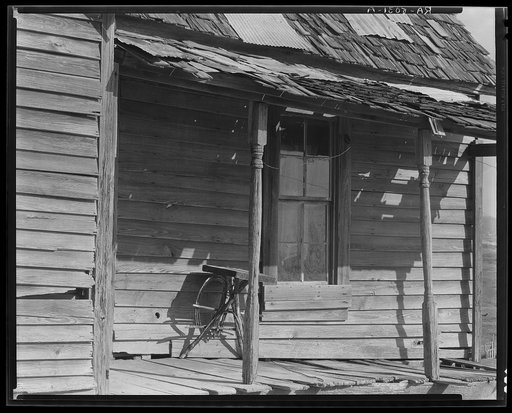 Porch of Negro shack. Outskirts of Tupelo, Mississippi