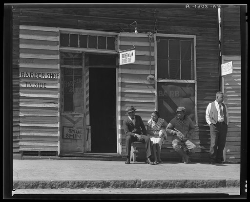 Vicksburg Negroes and shop front. Mississippi