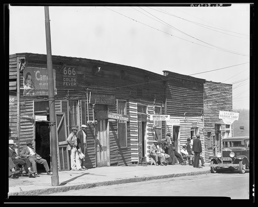 Vicksburg Negroes and shop front. Mississippi