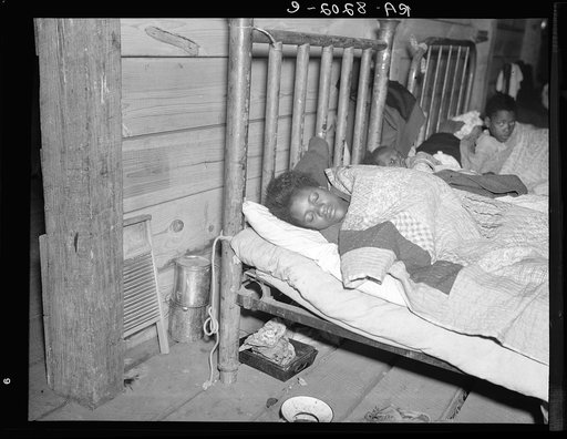 Sick flood refugee in the Red Cross temporary infirmary at Forrest City, Arkansas