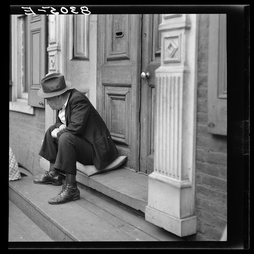 Man on doorstoop. Hagerstown, Maryland
