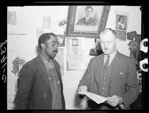 Nat Williamson and E.H. Anderson, Farm Security Administration official. Williamson was the first Negro in United States to receive a loan under the Tenant Purchase Program. Guilford County, North Carolina