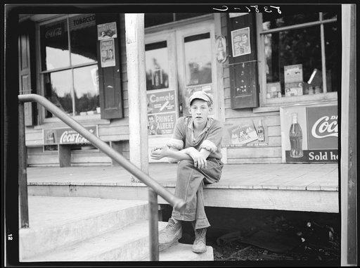 Boy on porch of general store. Roseland, Virginia
