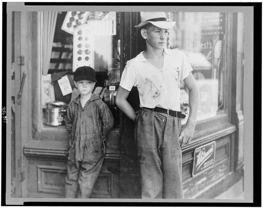 Boys in front of drugstore. Dover, Delaware