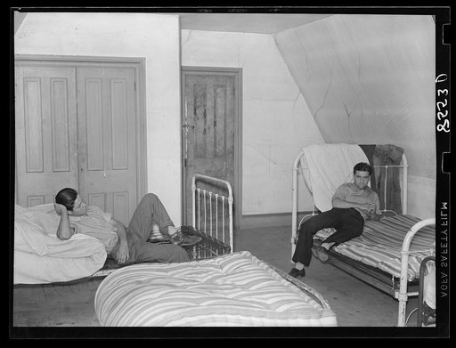 Bedroom in house occupied by thirty-five to forty people at King's Farm near Morrisville, Pennsylvania