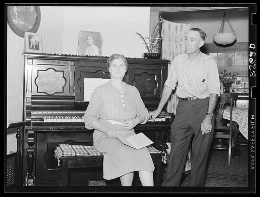 Mr. and Mrs. L.H. Adams in their home near Burlington, New Jersey. Adams is the first farmer in Region I to receive a loan under the tenant purchase plan