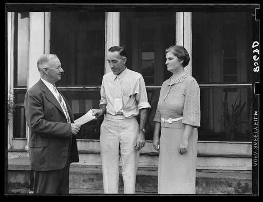 Presenting L.H. Adams with check for five thousand dollars. Adams was the first farmer in Region I to receive a loan under the tenant purchase program. Burlington, New Jersey