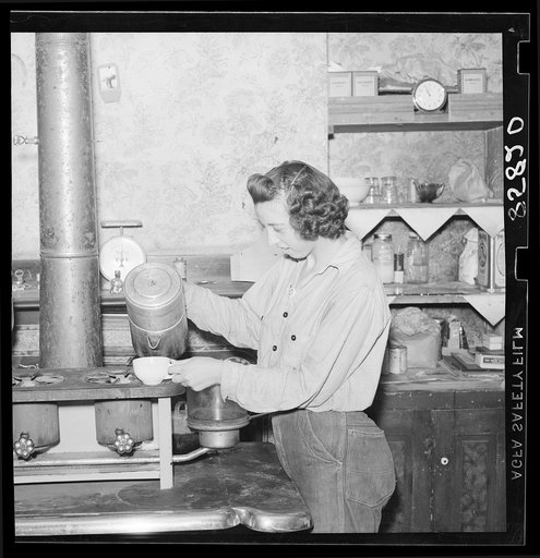Girl striker in kitchen of house occupied by thirty-five people. King Farm near Morrisville, Pennsylvania