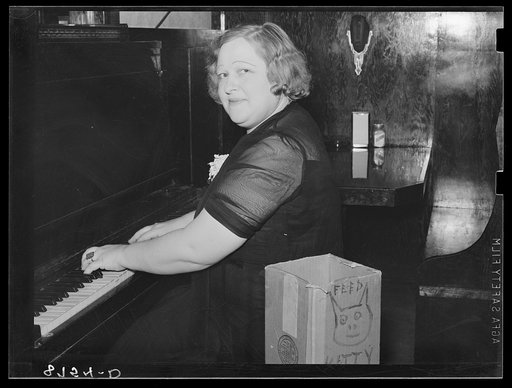 Entertainer in saloon. North Platte, Nebraska
