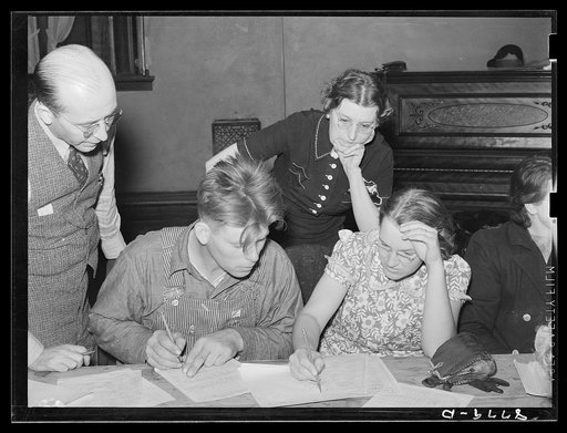 County supervisor and home supervisor helping young farm couple work out farm and home plans. Group meeting, York, Nebraska