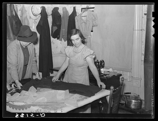 Farm Security Administration home supervisor helping rehabilitation client with sewing. Otoe County, Nebraska