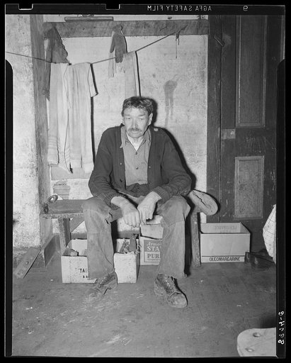 Old miner living in company house, rent free. He was injured while working in the mines several years ago, has been unable to work since. Company provides him free housing, and he lives on here, depending mainly on neighbors for food. Kempton, West Virginia