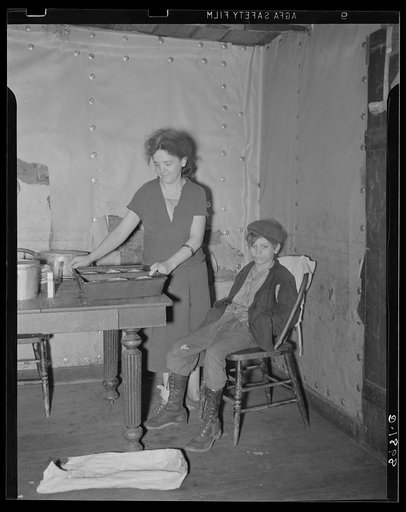 Wife and son of coal miner in kitchen of their home. Kempton, West Virginia