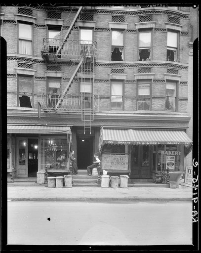 Background photo for Hightstown project. The present home of Mr. and Mrs. Jacob Solomon and family, 133 Avenue D, New York City. This family is included in the first unit of thirty-five families to be resettled at Hightstown in July, 1936. For four very small rooms in tenement they pay eighteen doll