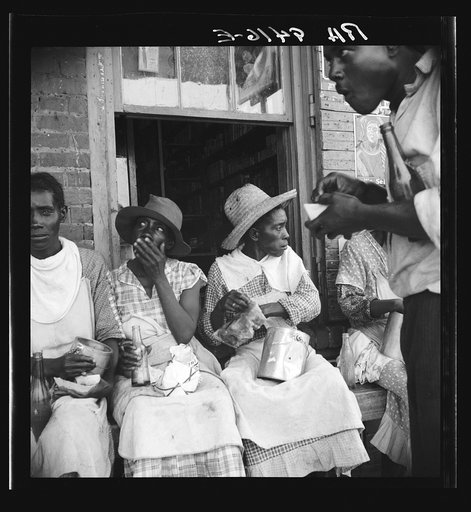 Lunchtime for the peach pickers. Muscella, Georgia