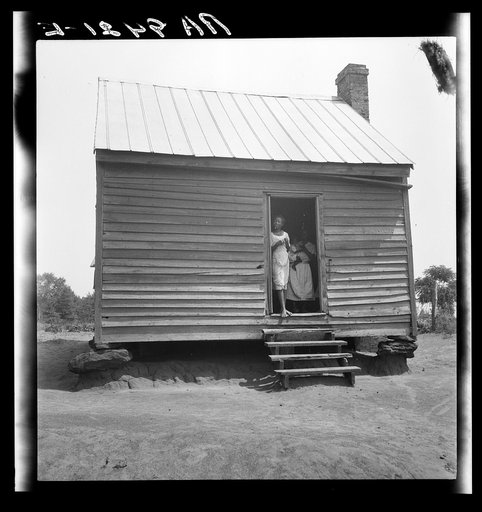 Peach picker's home near Muscella, Georgia "They don't lay nothing by for food. The biggest what they do when they git a little money is chung it over to automobiles"