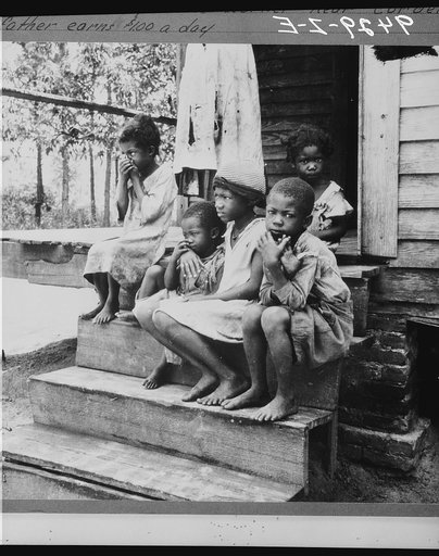 Children of turpentine worker near Cordele, Alabama. The father earns one dollar a day