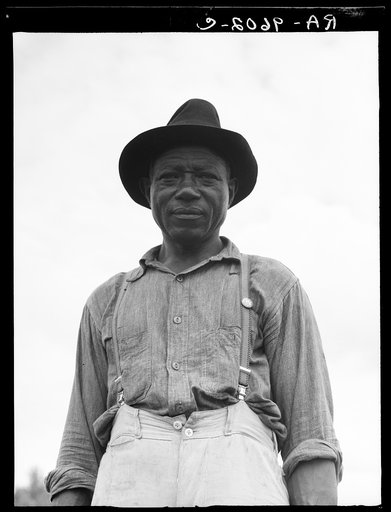 At Hill House, Mississippi. He wears the union button