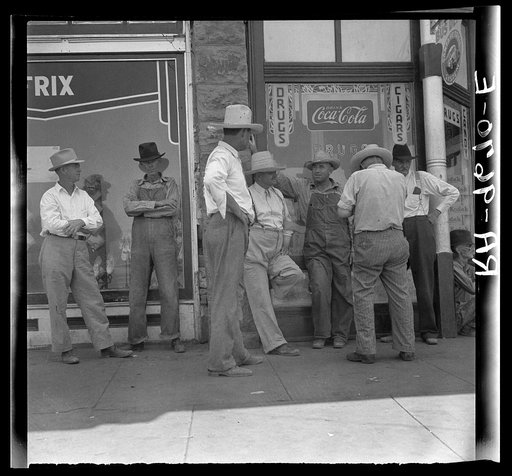 Drought farmers line the shady side of the main street on the town while their crops burn up in the fields. "Hello Bill, when's it gonna rain?"