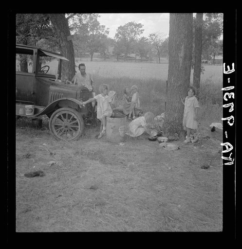 Migrant family from Oklahoma in Texas. A family of six alongside the road. An example of how they fall between the relief agencies. The father, aged thirty-five, is an intelligent fellow, a painter by trade. Advanced tuberculosis, victim of an occupational disease. Ineligible for WPA  (Works Progres
