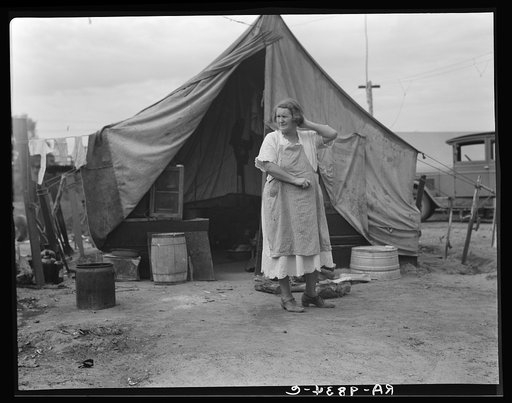 Mother of family of migrant fruit workers encamped on the outskirts of Porterville, California, waiting for work in the orange groves