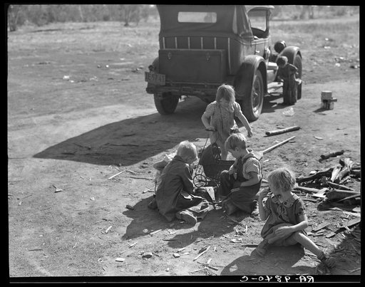 Children of migrant Oklahoma family, now living near Fresno, California, picking cotton