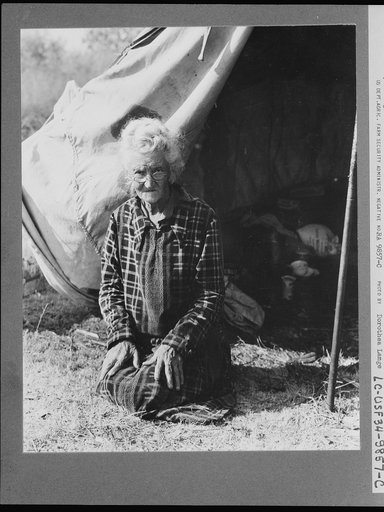 Grandmother of twenty-two children, from a farm in Oklahoma; eighty years old. Now living in camp on the outskirts of Bakersfield, California. "If you lose your pluck you lose the most there is in you - all you've got to live with"