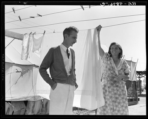 Tom Collins, manager of Kern migrant camp, talking with one of the members. California