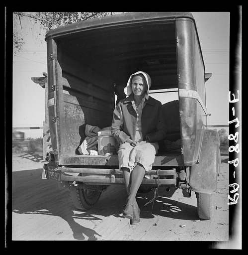 Migrant cotton picker on way to field. Kern migrant camp, California