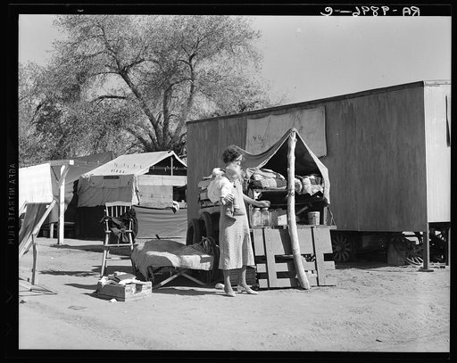 Tubercular mother from Oklahoma now living in the Kern migrant camp (resettlement), California. She receives daily visits from the county nurse. Her husband works in the cotton field and can pick one hundred pounds a day