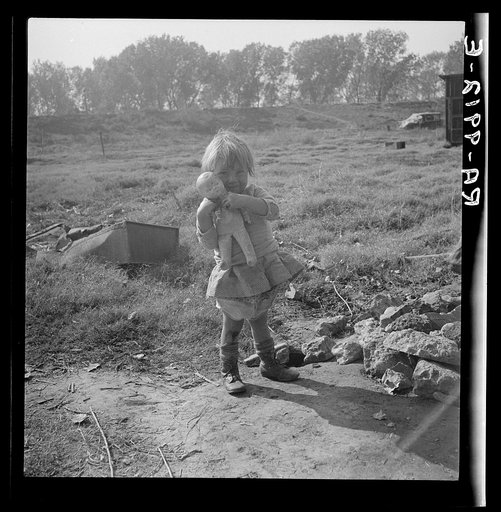 Daughter of a migrant fruit worker. American River camp outside of Sacramento, California
