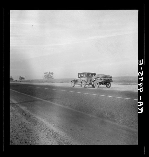 Migrant family on U.S. Highway 99 between Bakersfield and Famoso, California. Note: the photographer passed twenty-eight cars of this type while driving thirty-five miles between 9:00 and 9:45 in the morning