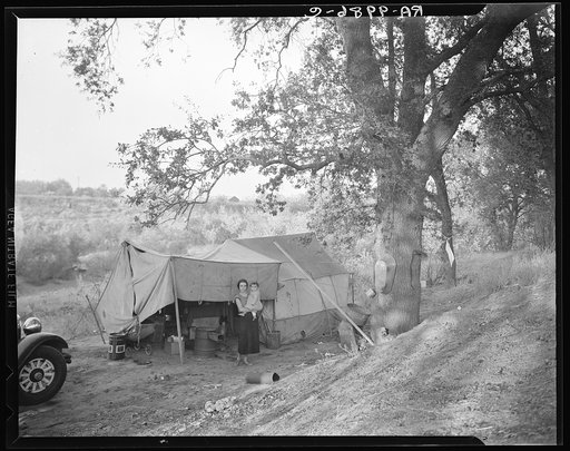 Wife and child of migrant worker, encamped near Winters, California. This is a proposed location of Resettlement Administration migrant camp