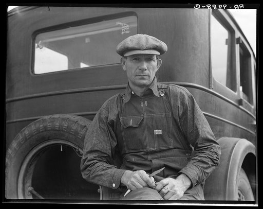 1936 drought refugee from Polk, Missouri. Awaiting the opening of orange picking season at Porterville, California