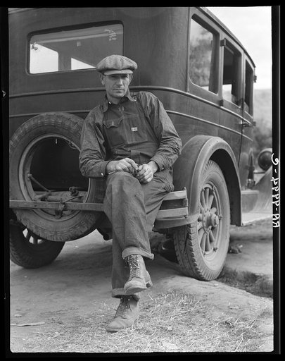 1936 drought refugee from Polk, Missouri. Awaiting the opening of orange picking season at Porterville, California