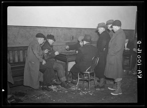 A game of checkers in a pool hall in Spencer, Iowa. Saturday afternoons and evenings are the crowded times